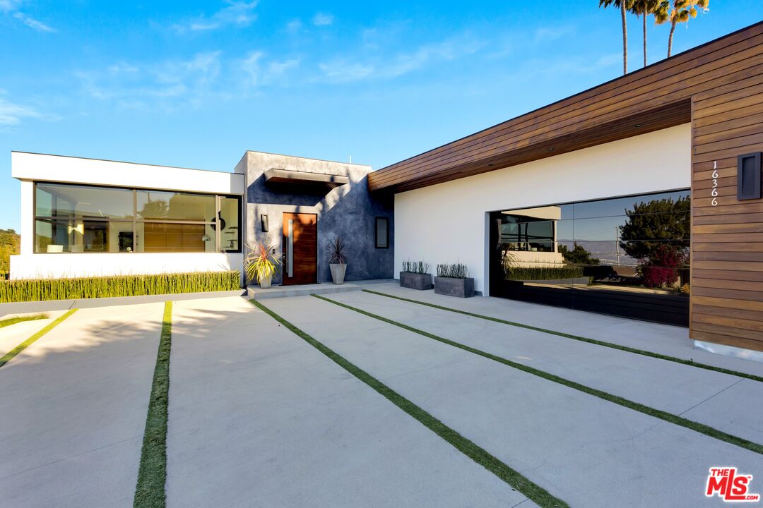 16366 Sloan Drive Los Angeles, CA 90049 - Photo 3 of 54 a view of a building with car parked