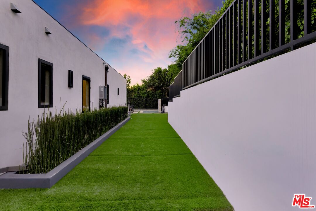 16366 Sloan Drive Los Angeles, CA 90049 - Photo 38 of 54 a view of a back yard of the house