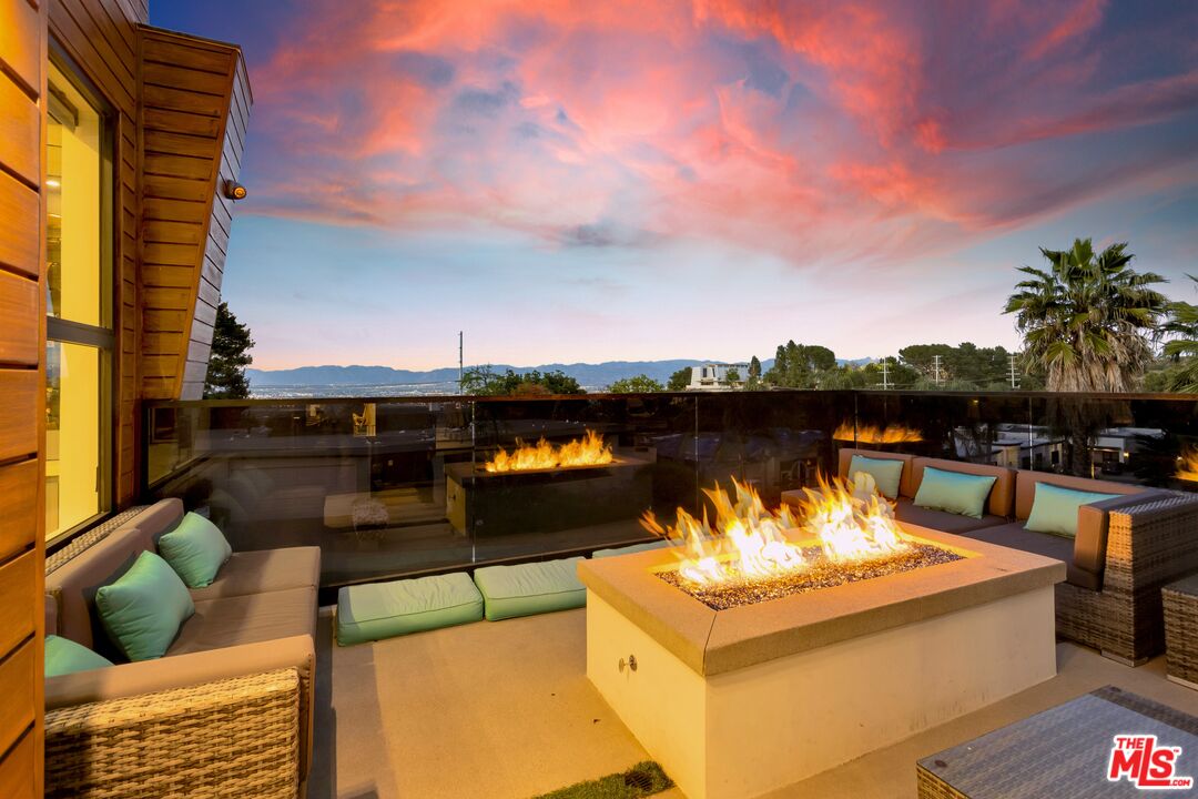 16366 Sloan Drive Los Angeles, CA 90049 - Photo 49 of 54 a view of a terrace with couches and sky view