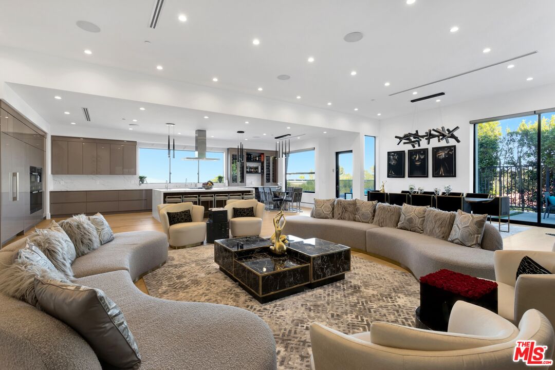 16366 Sloan Drive Los Angeles, CA 90049 - Photo 10 of 54 a living room with furniture and a large window