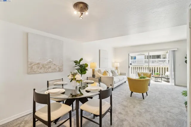 a dining room with furniture and window