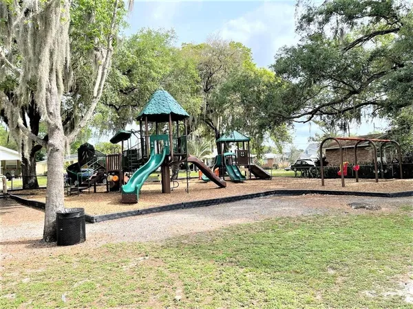 a view of a park with swings and slides
