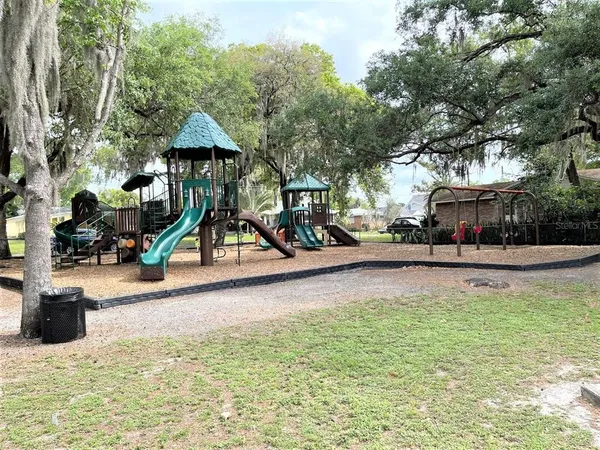 a view of a park with swings and slides