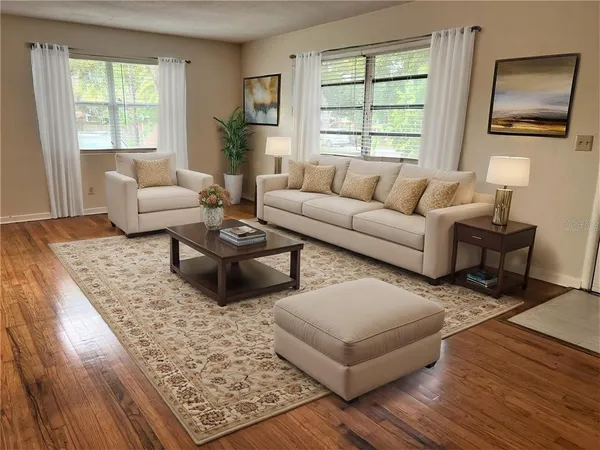 a living room with furniture and a window