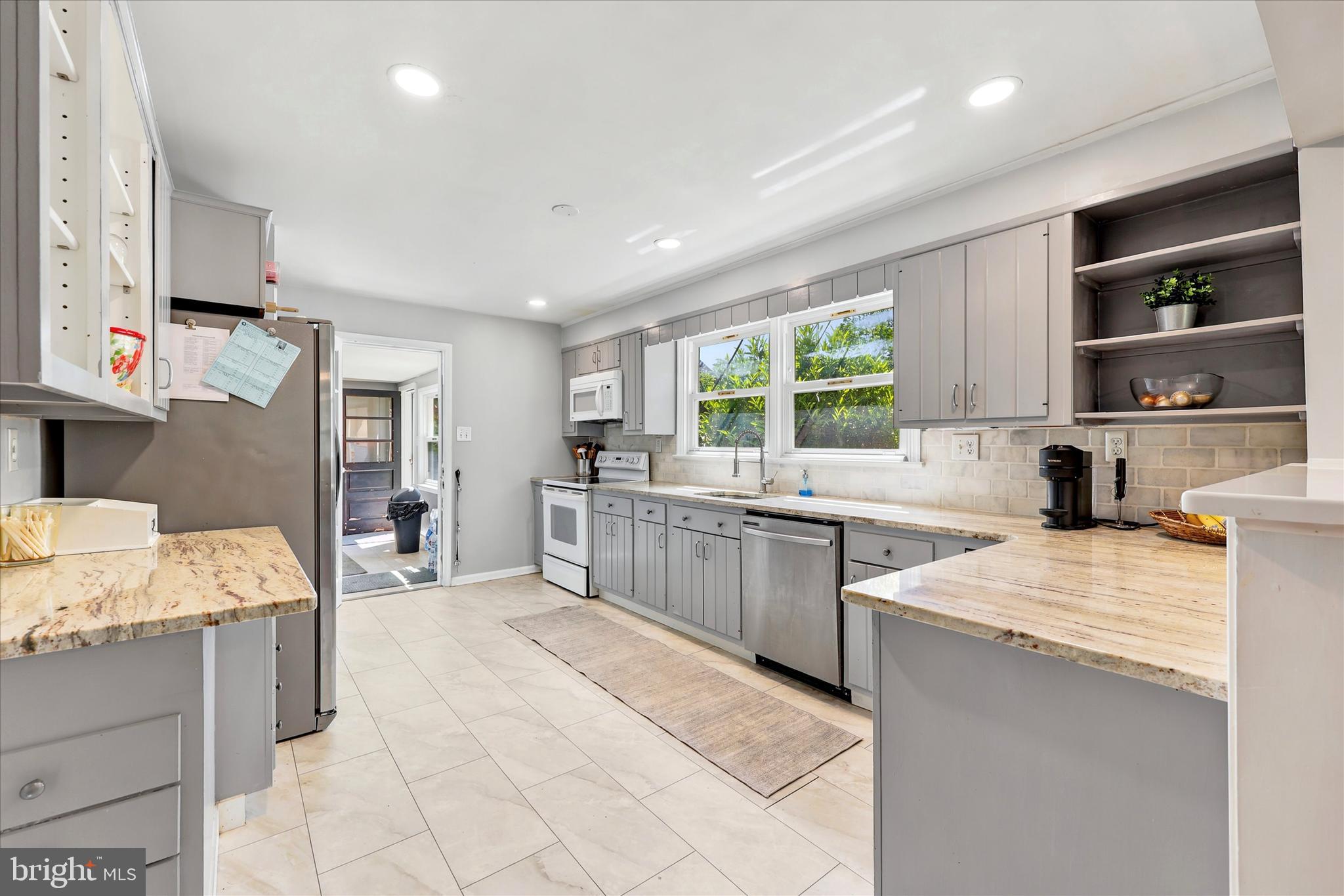 39 Haverford Road Ardmore, PA 19003 - Photo 7 of 24 a large kitchen with stainless steel appliances granite countertop a sink stove and refrigerator
