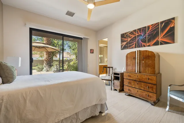 a view of a porch with furniture and a garage