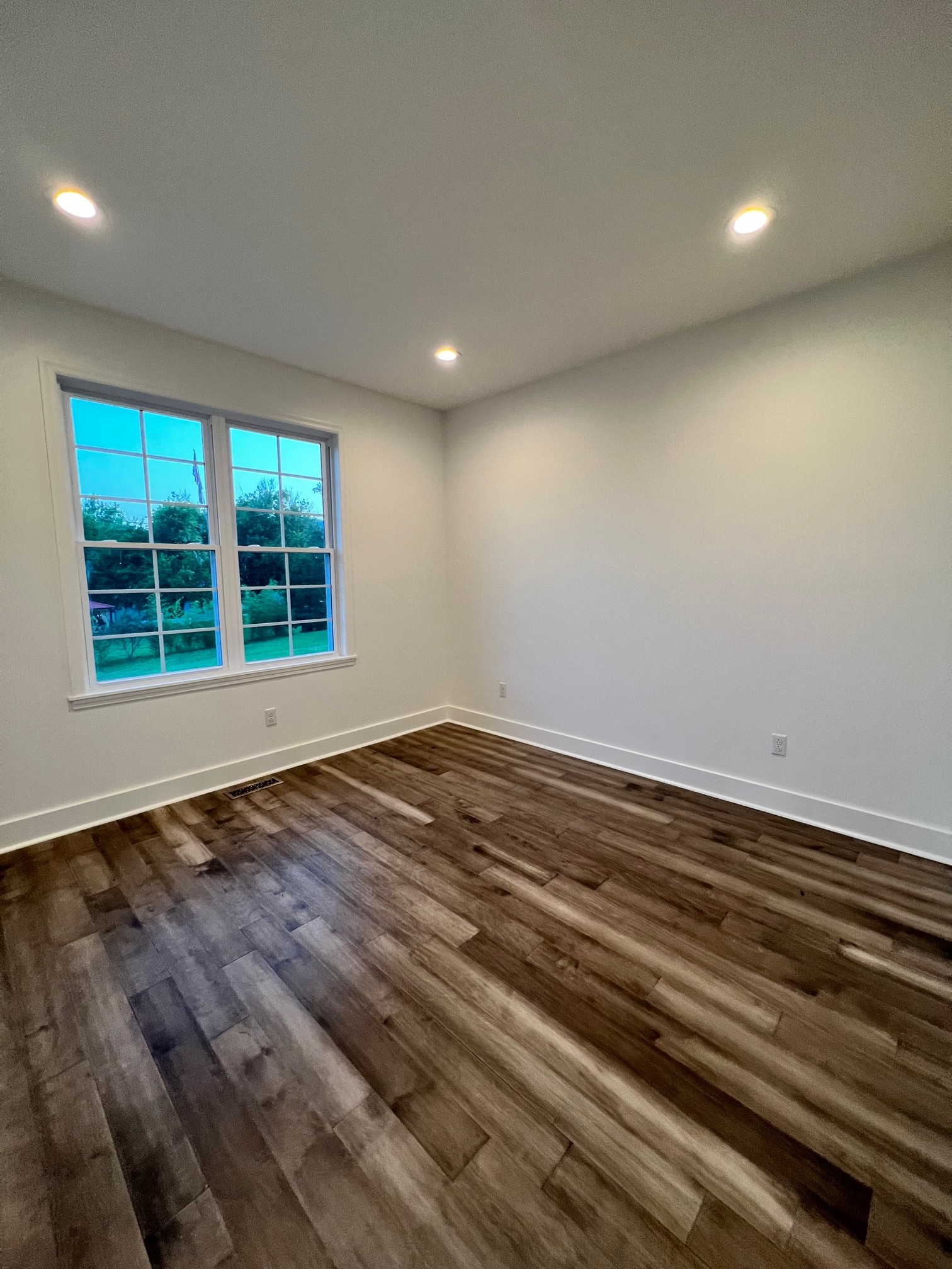 236 Buffalo Road Carthage, TN 37030 - Photo 35 of 55 an empty room with wooden floor and windows