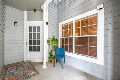 a blue and white door with a bench in patio