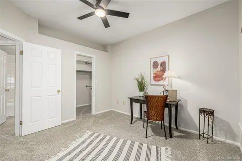 a workspace with furniture and a window