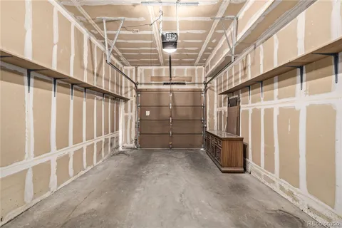 a view of an empty room with racks on the wall