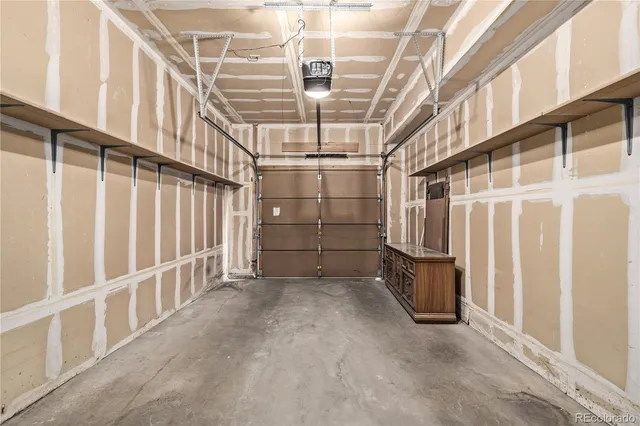 a view of an empty room with racks on the wall