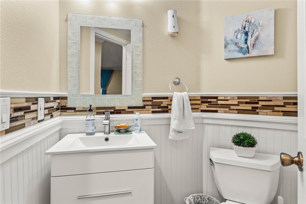 1560 Firestone Loop San Jose, CA 95116 - Photo 11 of 33 a bathroom with a sink a toilet and a mirror