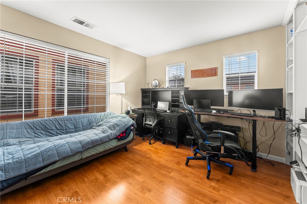 1560 Firestone Loop San Jose, CA 95116 - Photo 15 of 33 a bedroom with furniture and a window