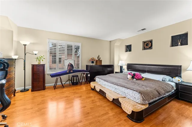 a bedroom with a bed and a table