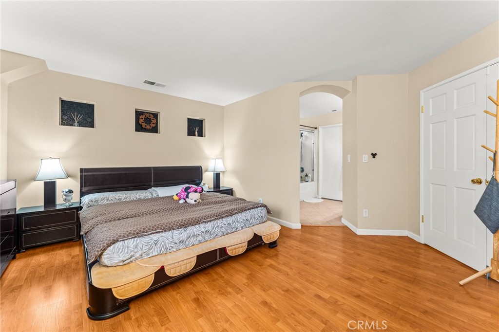1560 Firestone Loop San Jose, CA 95116 - Photo 19 of 33 a bedroom with a bed and a lamp