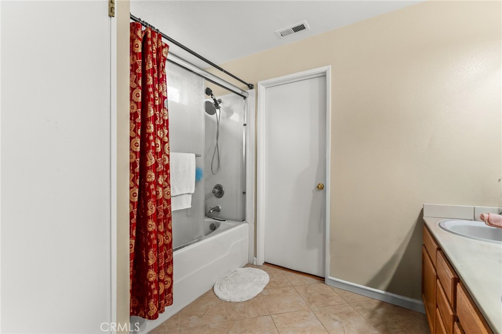 1560 Firestone Loop San Jose, CA 95116 - Photo 20 of 33 a bathroom with a shower and a sink