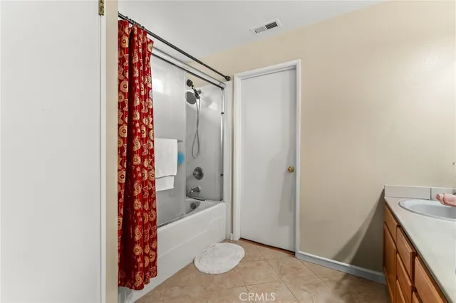 a bathroom with a shower and a sink