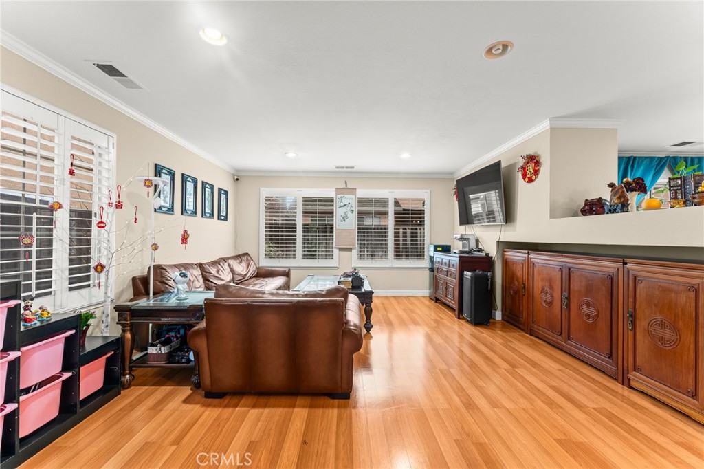 1560 Firestone Loop San Jose, CA 95116 - Photo 2 of 33 a living room with stainless steel appliances granite countertop a couch a table and chairs in it