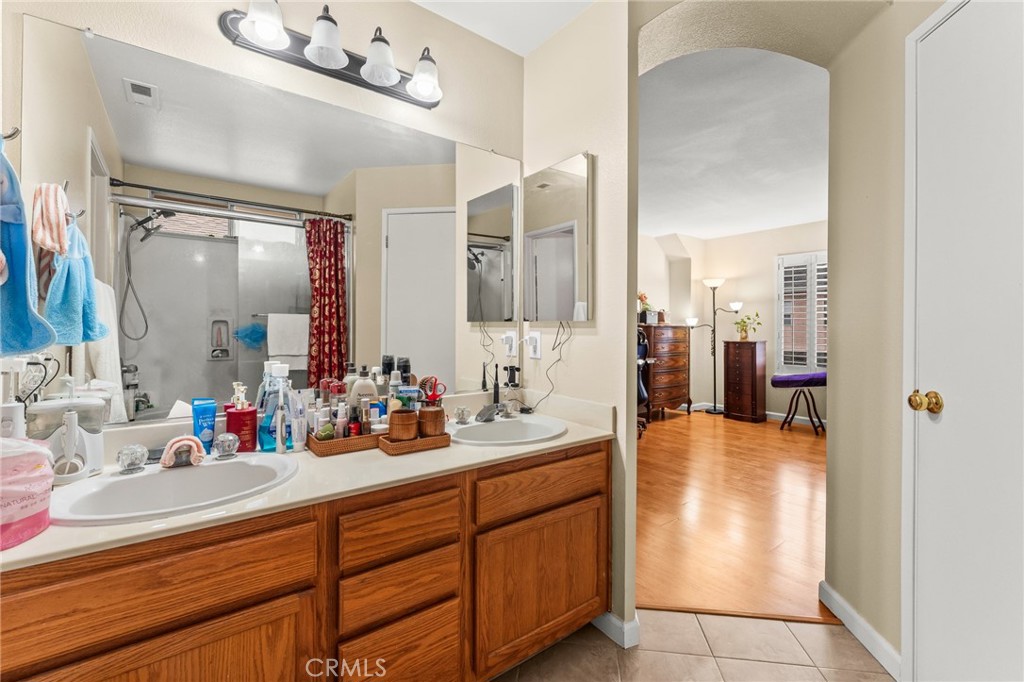 1560 Firestone Loop San Jose, CA 95116 - Photo 21 of 33 a bathroom with a sink double vanity and a mirror