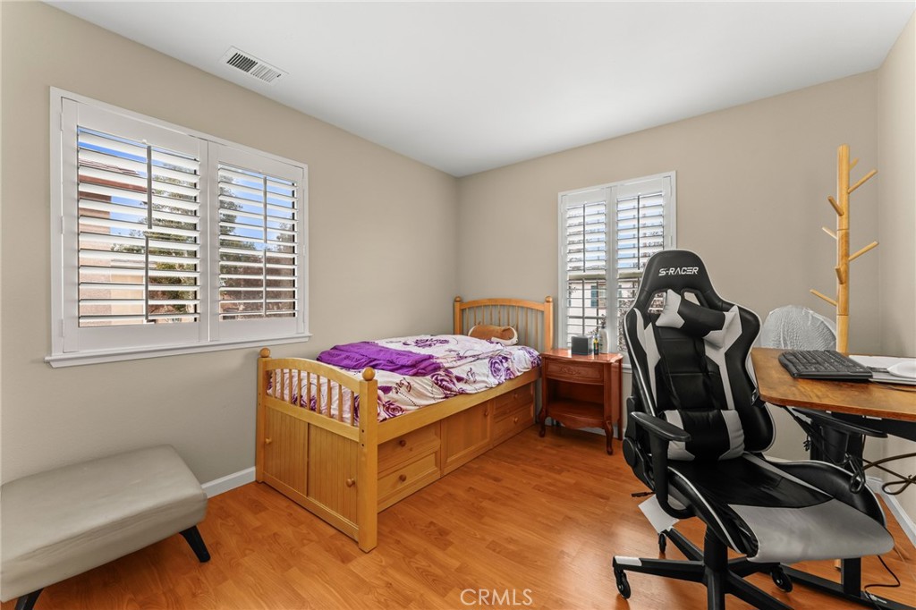 1560 Firestone Loop San Jose, CA 95116 - Photo 25 of 33 a bedroom with a bed and a window