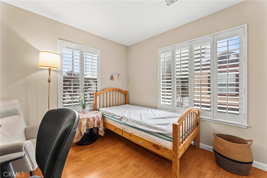1560 Firestone Loop San Jose, CA 95116 - Photo 27 of 33 a bedroom with a bed chair and a window