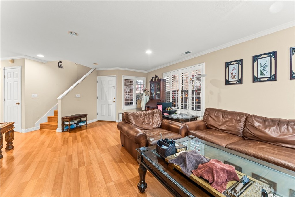 1560 Firestone Loop San Jose, CA 95116 - Photo 4 of 33 a living room with furniture and wooden floor
