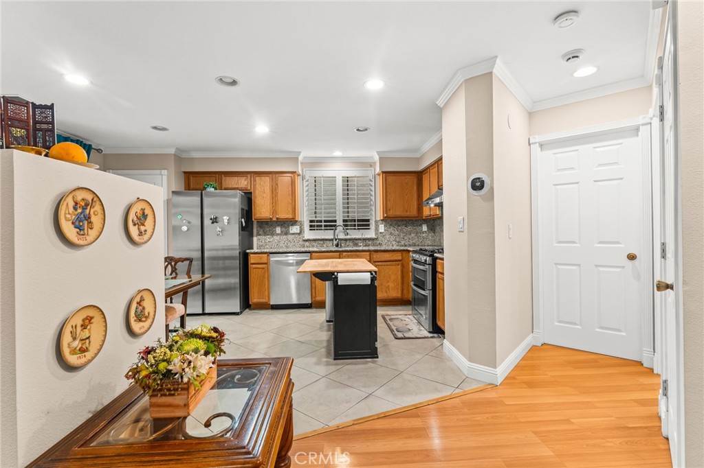1560 Firestone Loop San Jose, CA 95116 - Photo 5 of 33 a kitchen with refrigerator and dishwasher