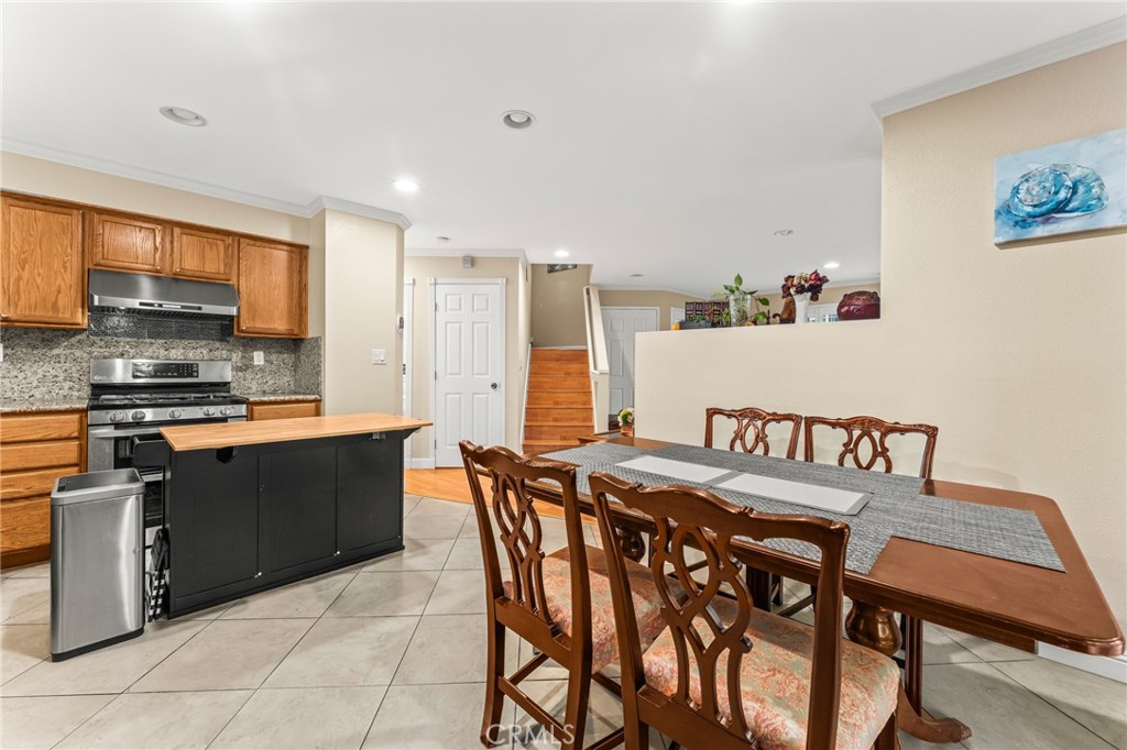 1560 Firestone Loop San Jose, CA 95116 - Photo 7 of 33 a kitchen with a table and chairs in it