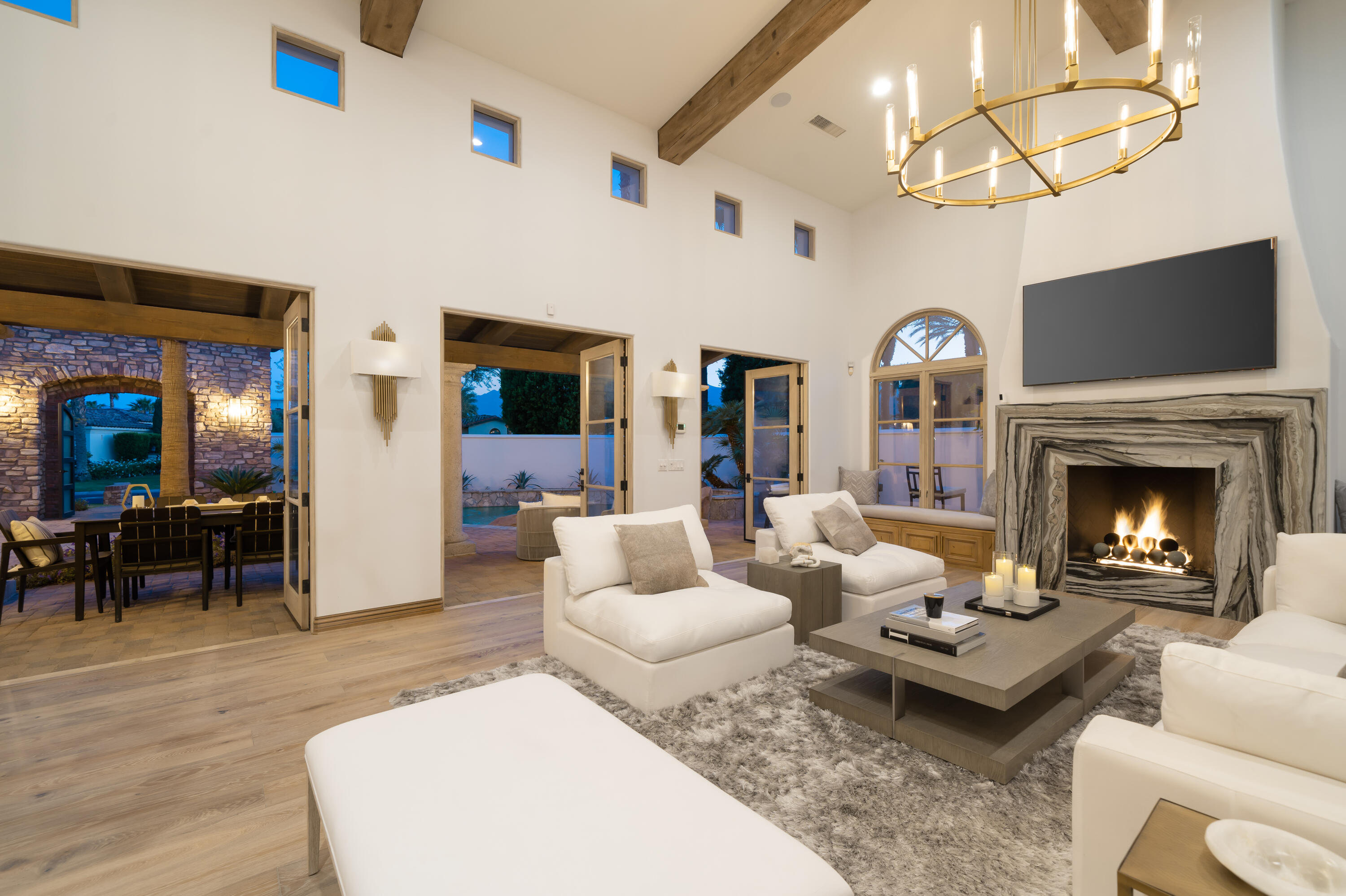 80820 Via Portofino La Quinta, CA 92253 - Photo 11 of 52 a living room with furniture fireplace and a table