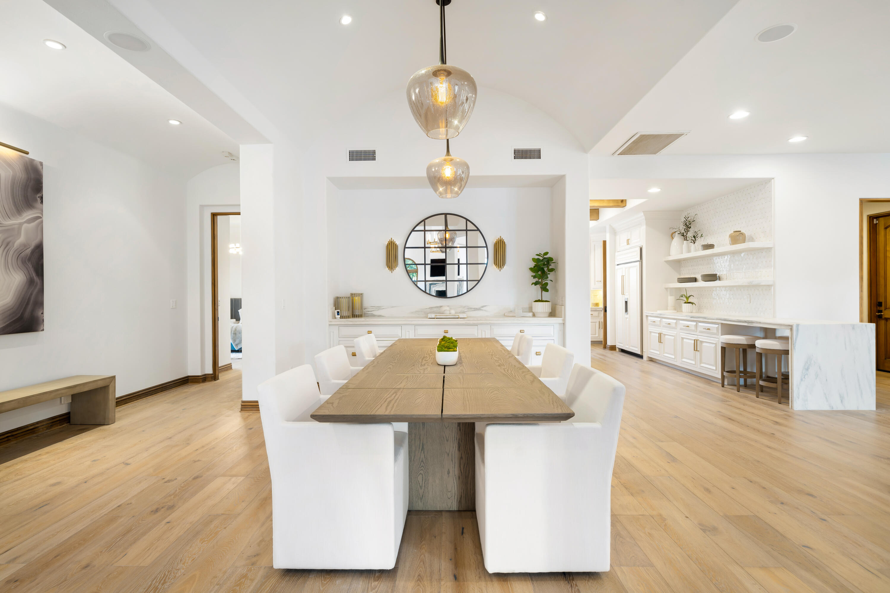 80820 Via Portofino La Quinta, CA 92253 - Photo 13 of 52 a room with kitchen island stainless steel appliances a table chairs and chandelier