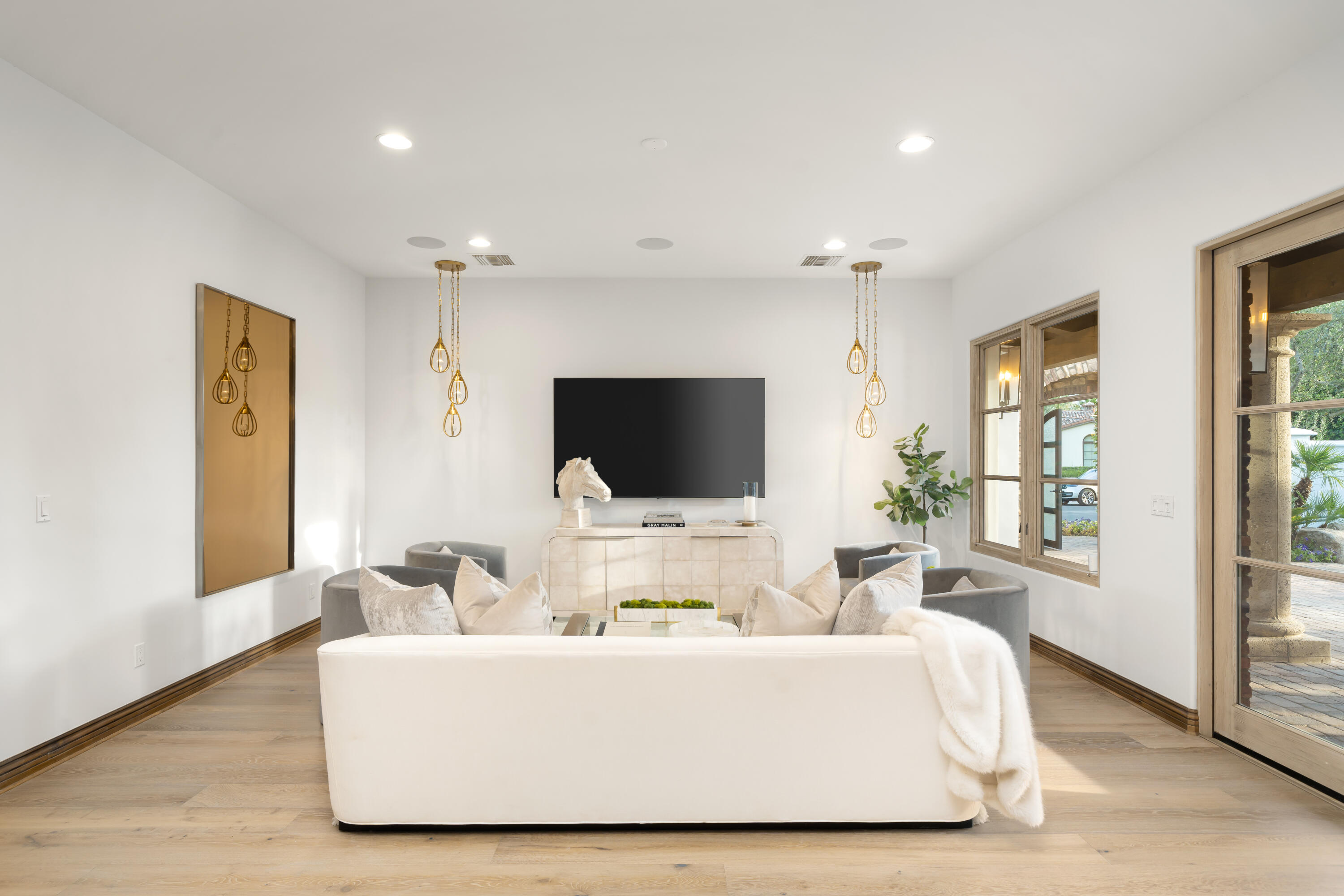 80820 Via Portofino La Quinta, CA 92253 - Photo 17 of 52 a living room with furniture wooden floor and a flat screen tv