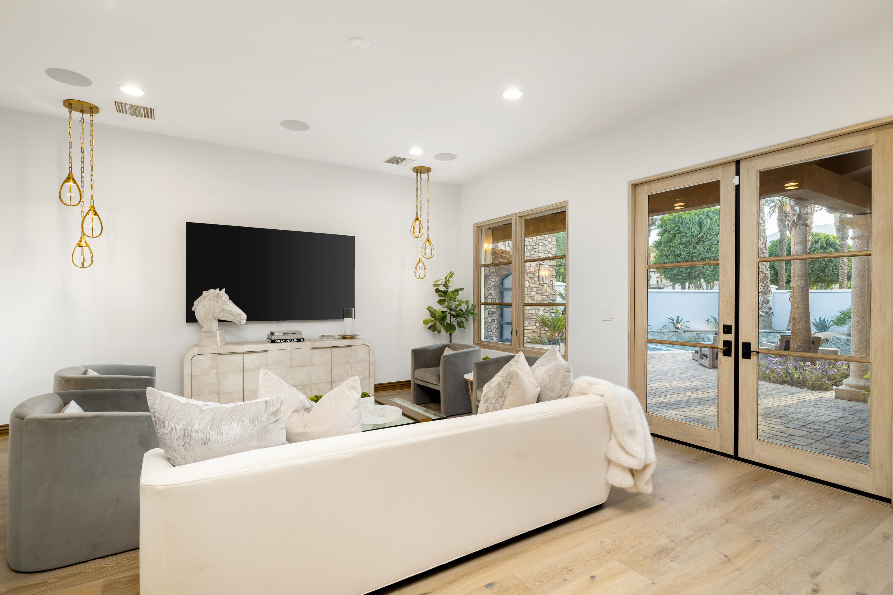 80820 Via Portofino La Quinta, CA 92253 - Photo 18 of 52 a living room with furniture and a flat screen tv