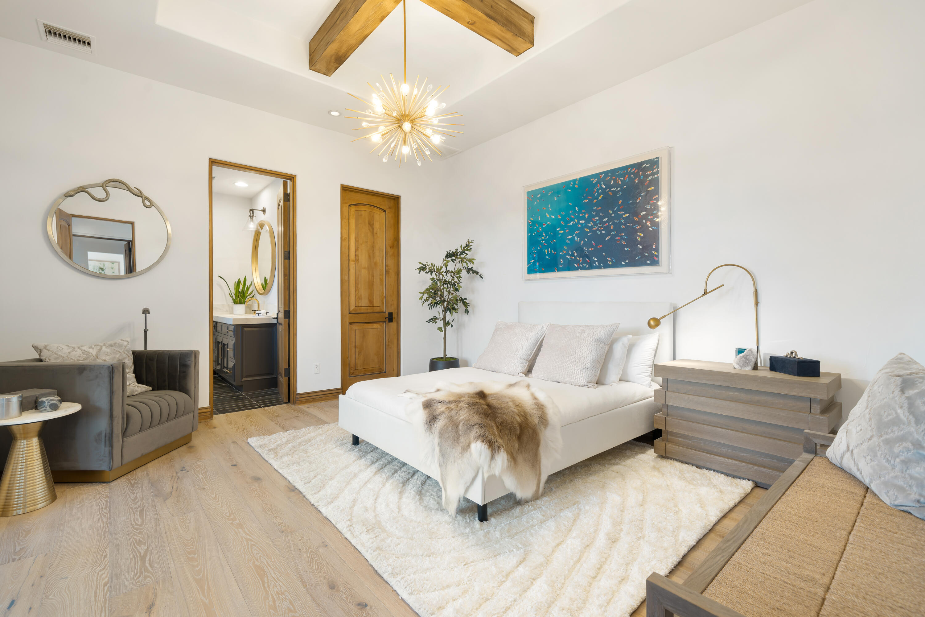 80820 Via Portofino La Quinta, CA 92253 - Photo 31 of 52 a bedroom with a bed and a chandelier