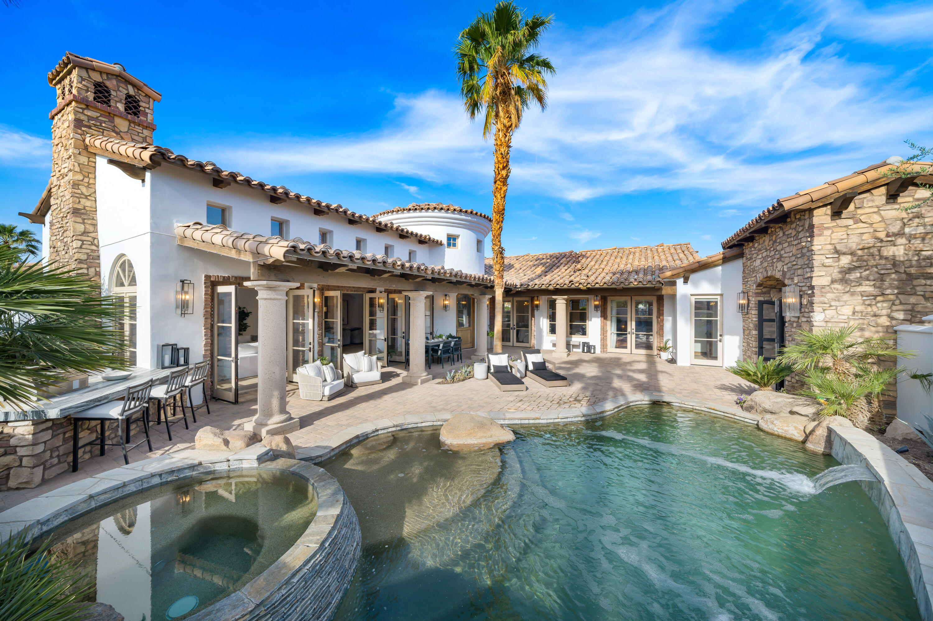 80820 Via Portofino La Quinta, CA 92253 - Photo 40 of 52 a view of a house with swimming pool and sitting area