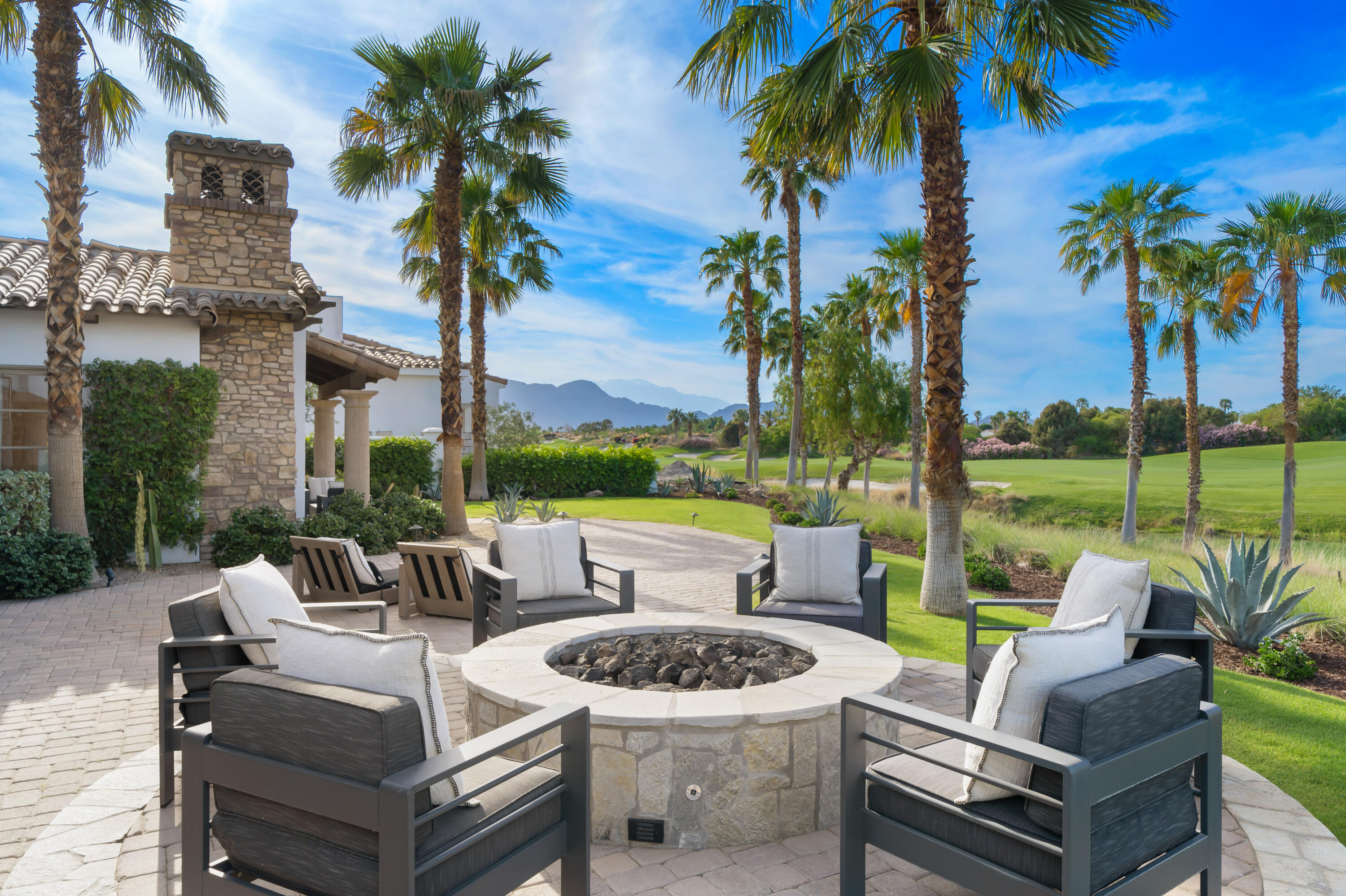 80820 Via Portofino La Quinta, CA 92253 - Photo 45 of 52 a view of a patio with couches potted plants and a big yard