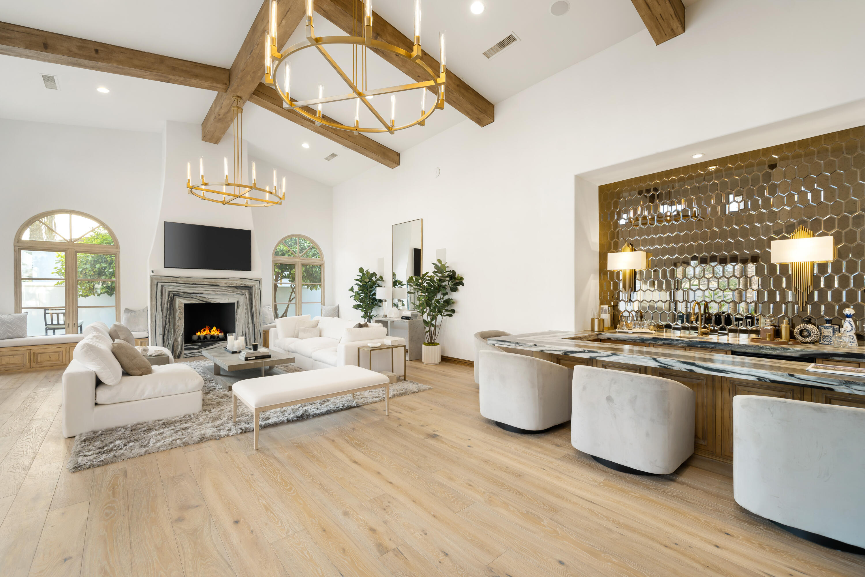 80820 Via Portofino La Quinta, CA 92253 - Photo 7 of 52 a living room with granite countertop furniture a fireplace and chandelier