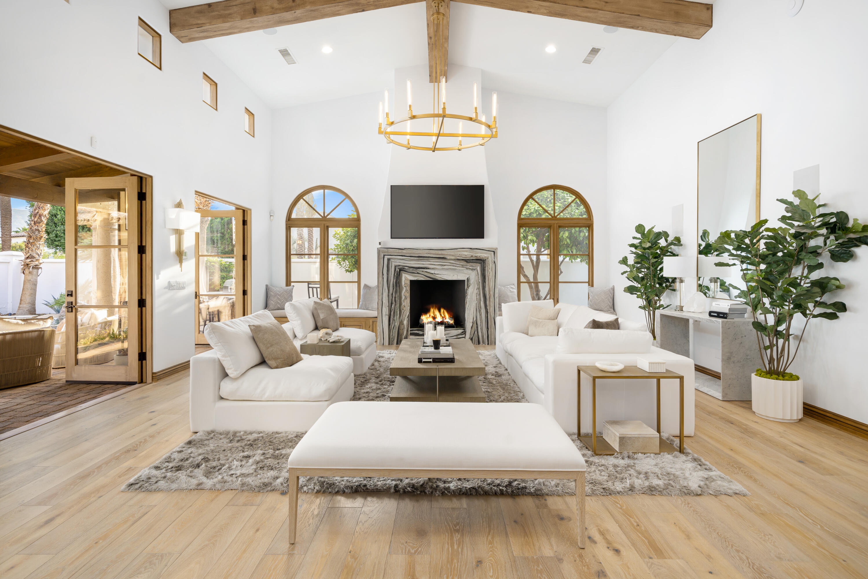 80820 Via Portofino La Quinta, CA 92253 - Photo 8 of 52 a living room with furniture fireplace and chandelier