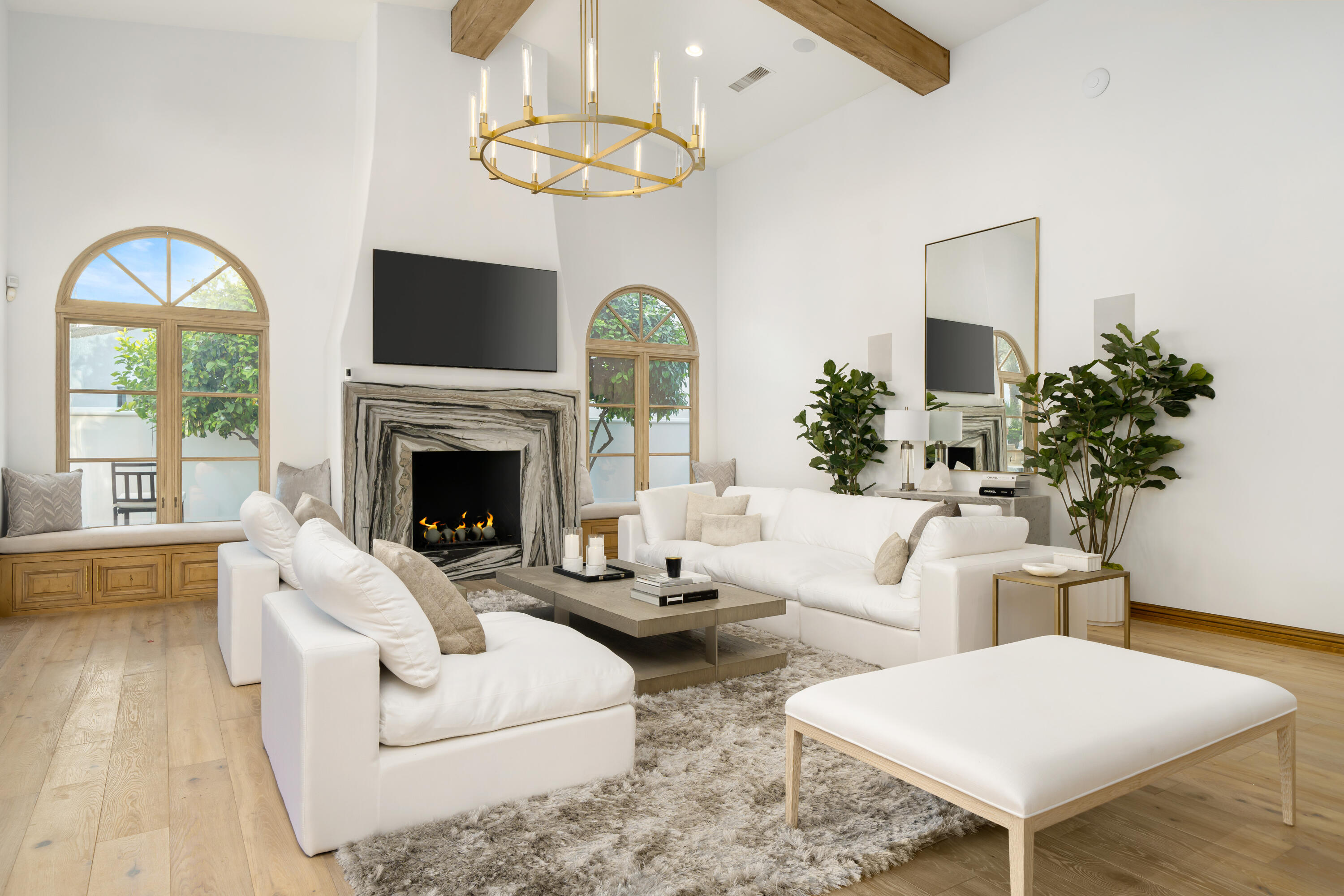 80820 Via Portofino La Quinta, CA 92253 - Photo 9 of 52 a living room with furniture a chandelier and a fireplace