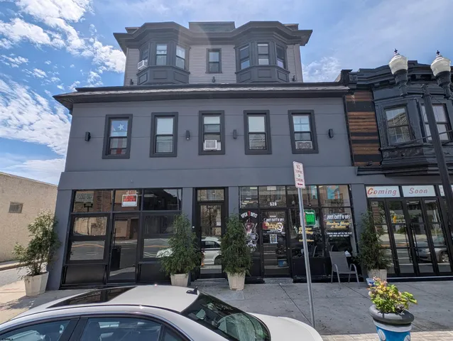 a front view of a building with glass windows