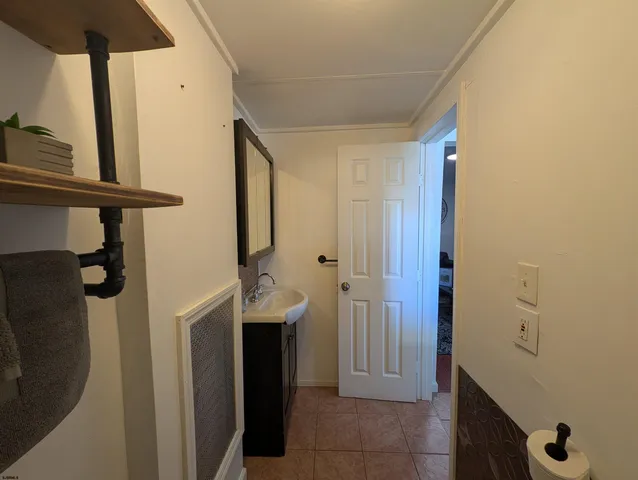a bathroom with a sink and mirror