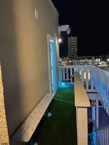 a night view of a fountain in the middle of a building