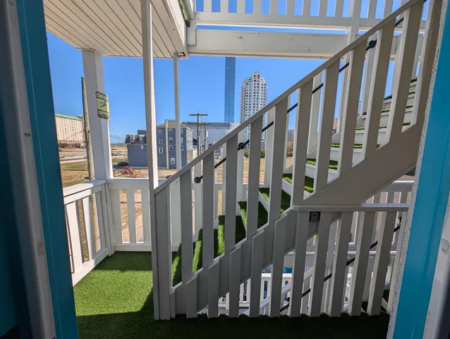 a view of staircase with lots of trees in the background