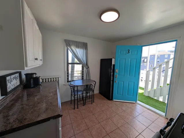 a view of a livingroom with furniture and window