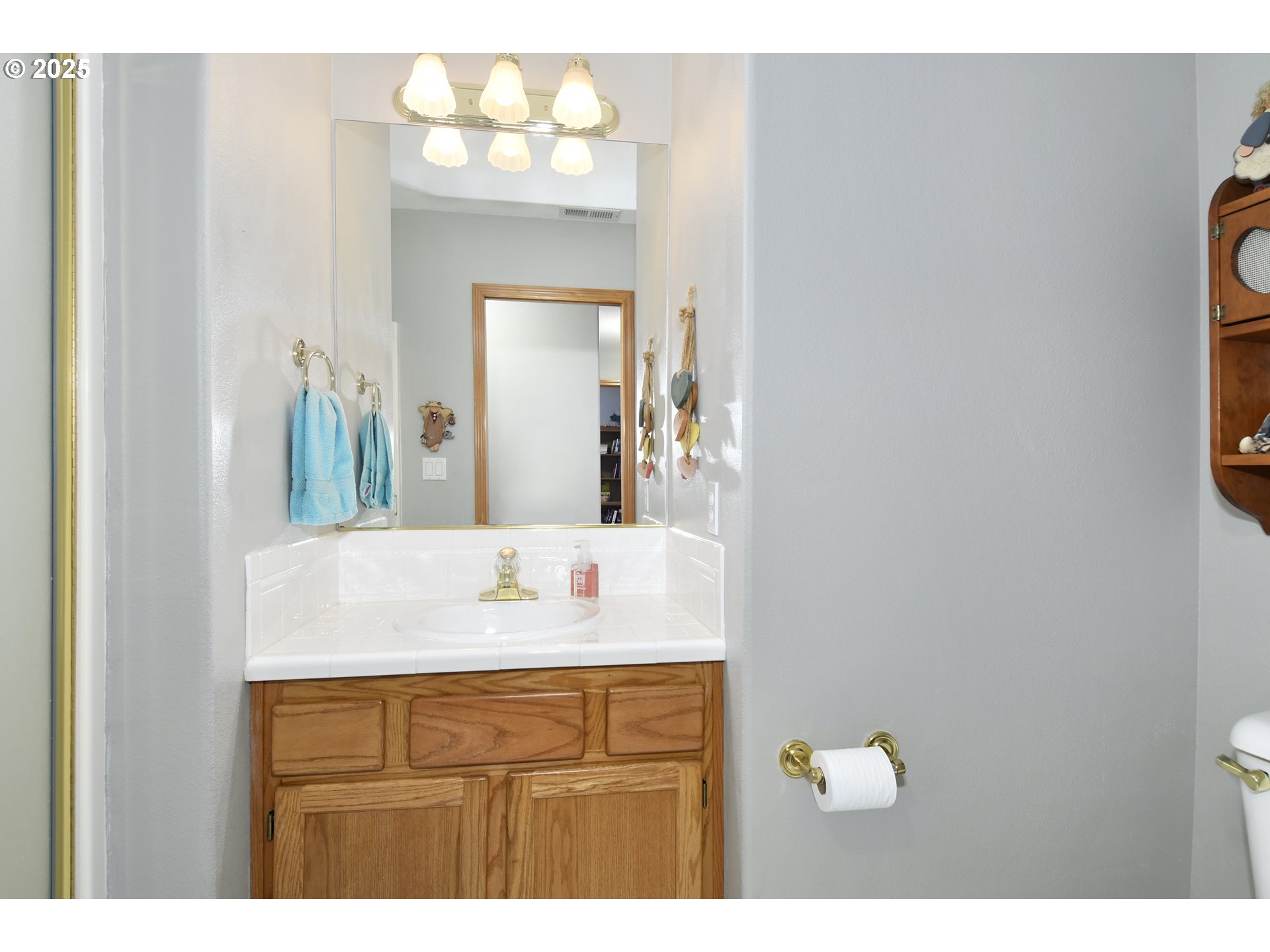 4396 Southeast 1st Terrace Gresham, OR 97080 - Photo 22 of 36 a bathroom with a sink vanity and a mirror