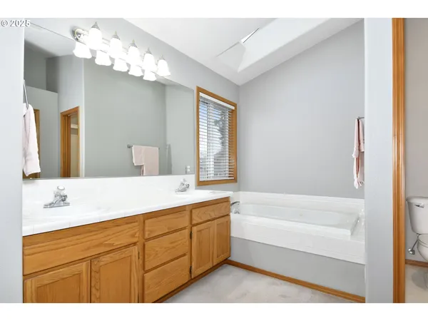 a bedroom with a bed and a lamp with window