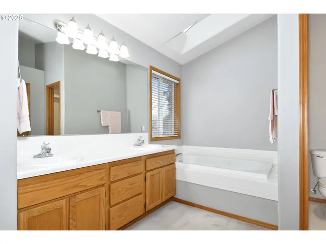 a bedroom with a bed and a lamp with window