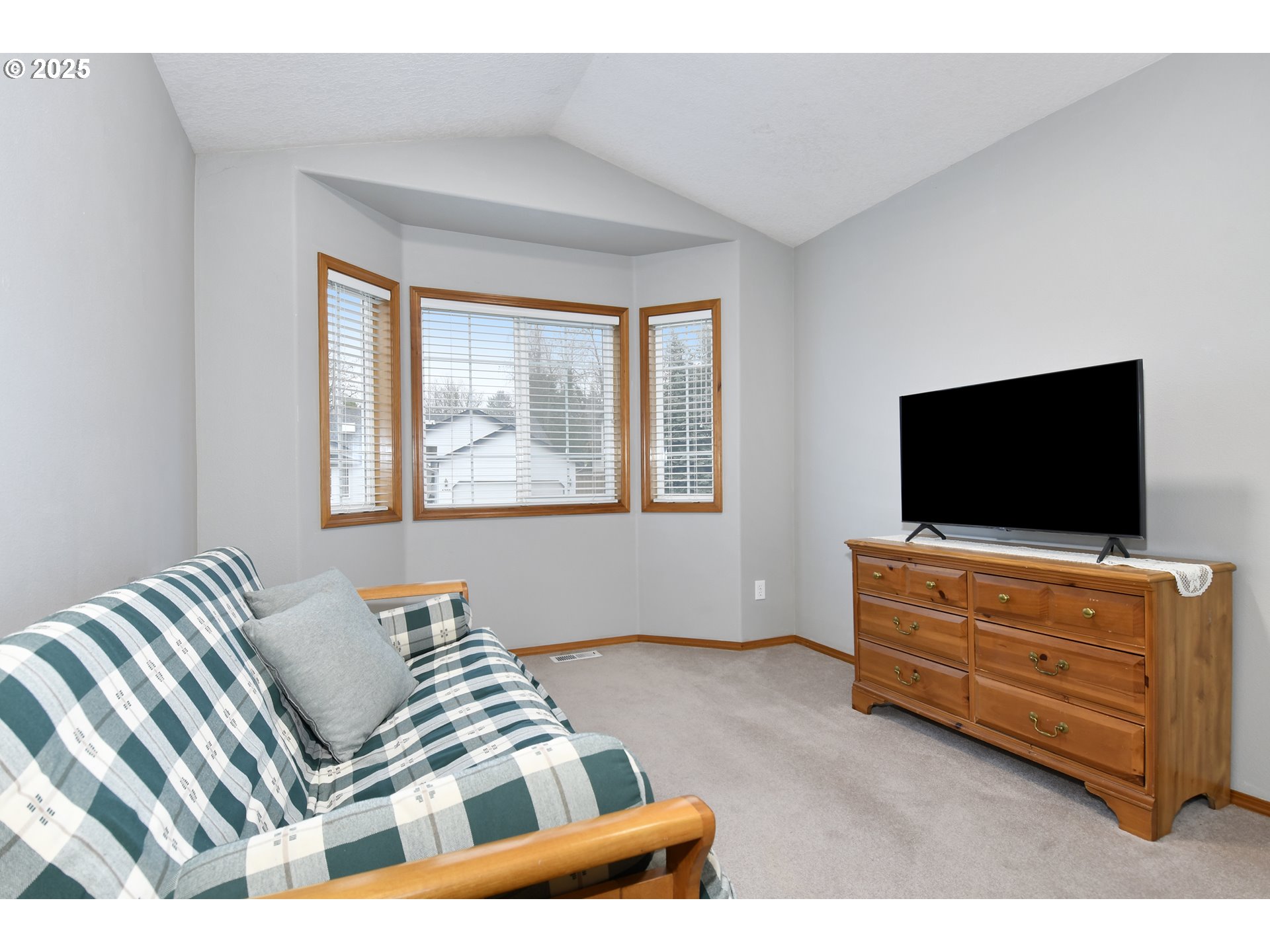 4396 Southeast 1st Terrace Gresham, OR 97080 - Photo 30 of 36 a living room with furniture and a flat screen tv