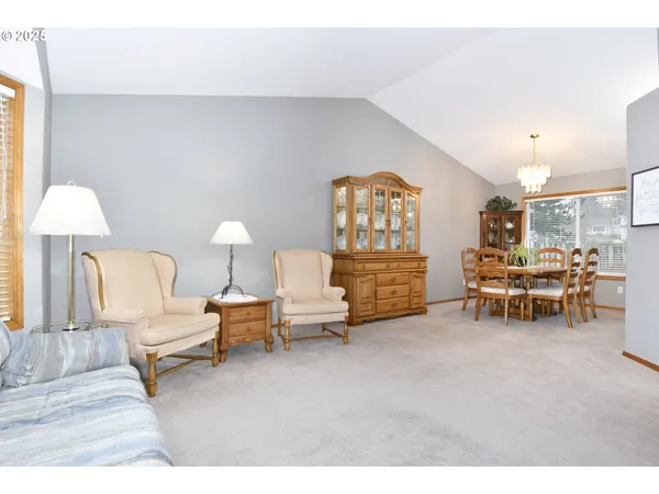 a living room with furniture and a chair