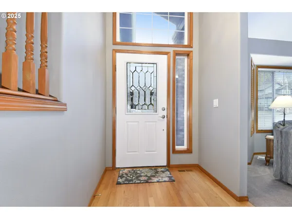 a view of an entryway with wooden floor