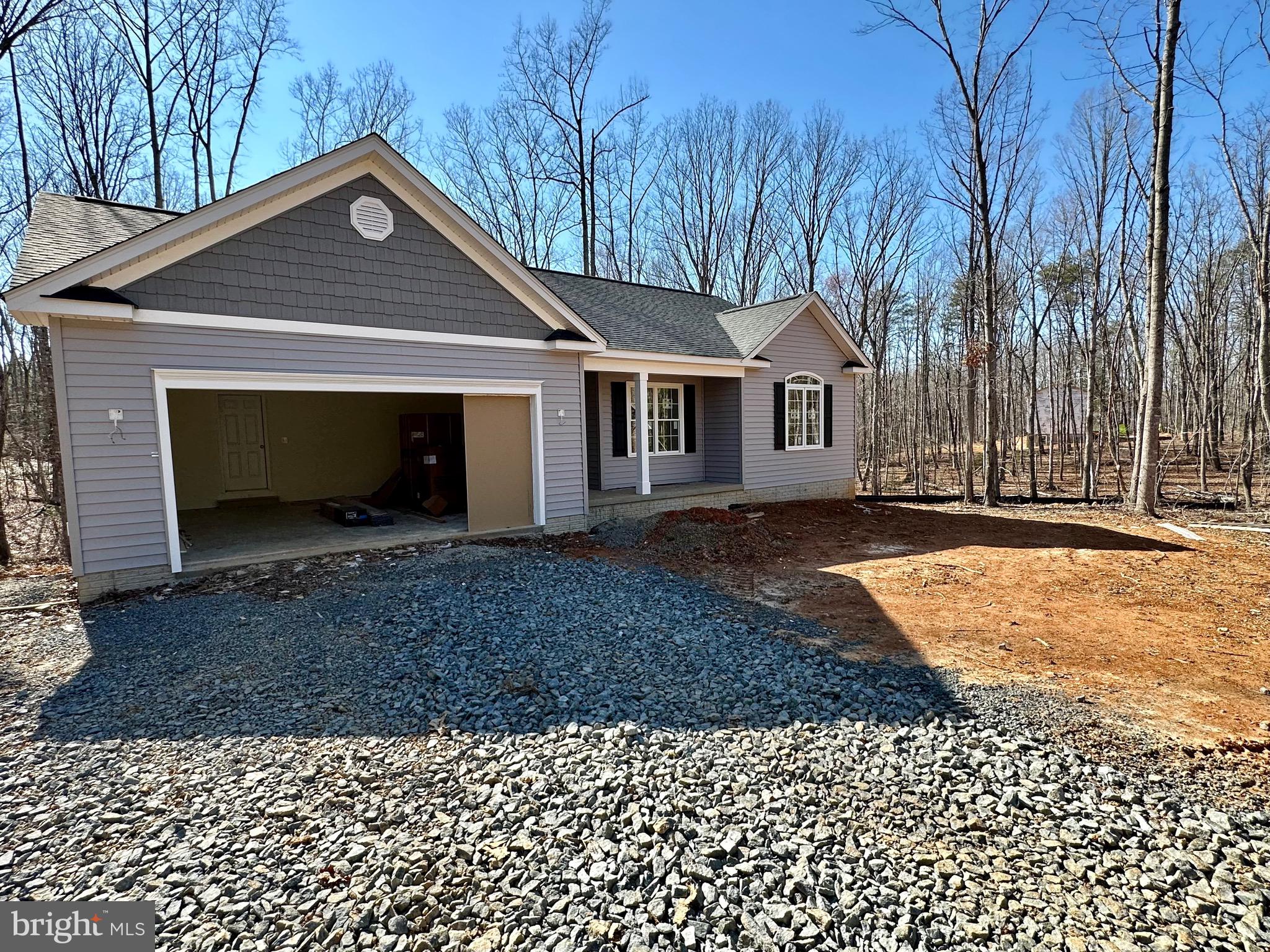 12215 Autumn Ridge Lane Unionville, VA 22567 - Photo 2 of 2 a front view of a house with a yard